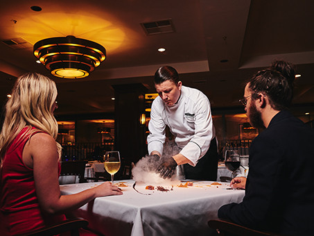 Couple sharing an intimate meal at a fine dining restaurant in Destin, FL